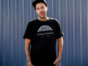 person modeling the black Hama Hama Oyster Company bridge logo tee shirt